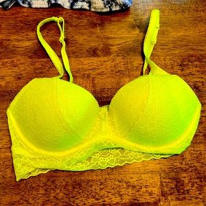 Neon yellow green , pink bralette .